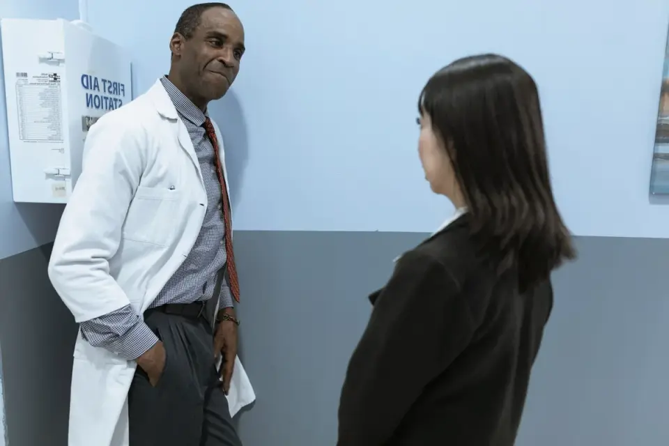 A veterinarian speaking with a dog owner during a calm exam room visit