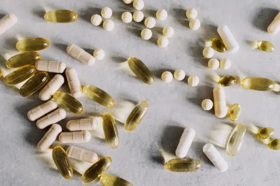 Soft chew supplements next to a senior dog's food bowl on a kitchen counter